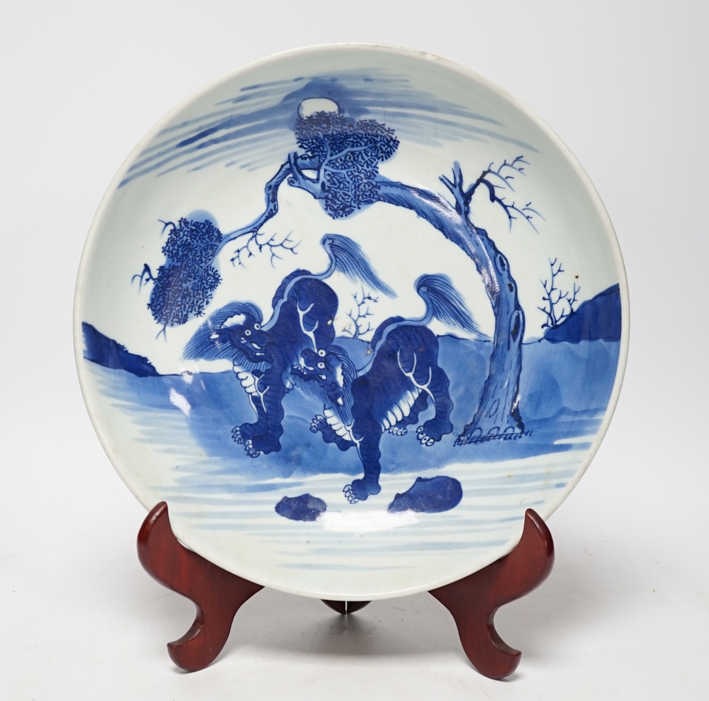 A large Chinese blue and white ‘mythical beasts’ saucer dish, Yongzheng period